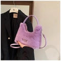Detailed texture of fluffy purple faux fur handbag with stylish leather handles - Purple