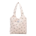 Bolso tote de pana beige con estampados de caritas negras y etiqueta tejida de Chie'5nd - Blanco