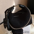 Black plush faux shearling handbag with silver chain and bow charm detail - Black