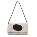 Minimalist white faux shearling tote bag with black leather logo and shoulder strap - White