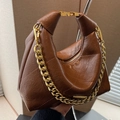 Retro brown pleated leather dumpling bag with chunky gold chain and metal handle detail - Brown