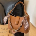 Brown litchi grain leather trapezoid handbag with gold chain and silk scarf detail - Biscuit