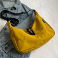 Chic mustard yellow nylon dumpling bag with adjustable black shoulder strap and rope zipper - Yellow
