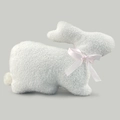 Plush Easter bunny throw pillow in white sherpa fabric with a soft pink satin bow - Crouching Bunny Style