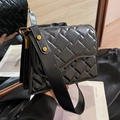 Chic black quilted leather crossbody bag featuring wide strap and gold hardware accents - Black