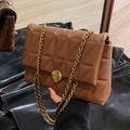 Brown quilted chain shoulder bag with a gold circular clasp and vintage finish - Brown