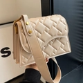 Quilted cream crossbody bag with soft padding and gold-toned metal hardware accents - Khaki