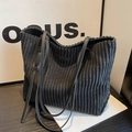 Dark grey corduroy tote bag with black leather straps and wavy edge detailing - Black