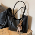 Classic black leather tote bag with a cute brown bunny charm for minimalist style - Black