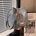 Denim patchwork bucket bag with grey leather trim and adjustable shoulder strap - Blue