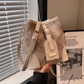 Retro bucket bag featuring beige textured fabric with brown leather trim and metal hardware - Off-white