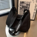 Black crescent canvas bag with adjustable FASHION letter strap and spacious urban design - Black