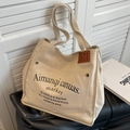 Tragetasche aus cremeweißem Segeltuch mit Vordertasche und Vintage-Details in Innenraum - Beigegrau