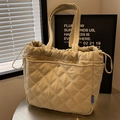 Beige quilted tote bag with diamond pattern, drawstring closure, and metal button pocket - Off White