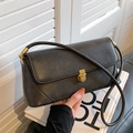 Matte black oversized underarm bag with gold metal clasp and premium faux leather finish - Black