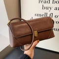 Vintage brown leather shoulder bag with antique metal clasp and retro V-line side detail - Brown