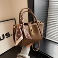 Brown faux leather bucket bag with metallic ring handle and heart print scarf detail - Brown