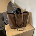 Dark brown large tote bag with contrast white stitching and minimalist shoulder design - Brown
