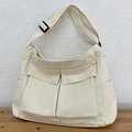Grand sac cabas en toile crème avec deux poches avant et bandoulière réglable pour femme - Blanc Cassé