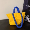 Quilted yellow cotton tote bag with blue contrast handles for commuting and school - Yellow