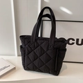 Large black quilted nylon tote bag with classic diamond stitching for women's daily commute - Black