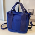 Dark blue canvas tote bag with adjustable shoulder straps and front pocket - Blue