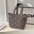 Quilted grey nylon tote bag featuring a diamond pattern and functional side pockets - Gray
