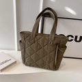 Olive green quilted nylon tote bag with rhombus pattern and dual handles in soft light - Green