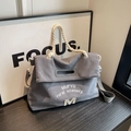 Gray-blue corduroy tote bag with M patch and cotton rope handle in side view - Blue Gray