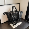 Elegant black quilted puffer tote bag featuring a large capacity for daily commuting - Black