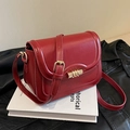 Elegant retro dark red leather saddle bag with golden metal buckle on books - Wine Red Style 2