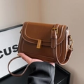 Vintage brown frosted faux leather crossbody bag with elegant gold metal buckle detail - Brown