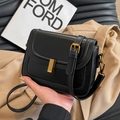Matte black leather underarm bag with vintage gold hardware and flap closure for women - Black