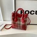Red leather bucket bag with plaid fabric pattern and adjustable crossbody strap - Red Grid
