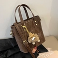 Dark brown quilted bucket bag with plush monster charm and detachable shoulder strap - With Charm / Lattice Coffee