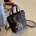 Dark brown quilted bucket bag with plush charm and adjustable shoulder strap - With Charm / Diamond Pattern Black