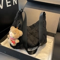 Black quilted nylon tote bag with wide shoulder strap and cute plush bear charm decoration - Black With Pendant