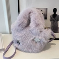 Fuzzy faux fur bucket bag in light purple with star charm and leather strap - Purple