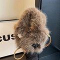 Brown faux fur bucket bag with star patterns and a slim leather strap - Brown