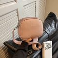 Pink pebbled leather crossbody bag with broad geometric strap and triple zippers - Khaki
