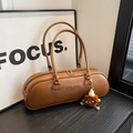 Vintage brown leather cylinder shoulder bag with plush charm and embossed logo - Brown with Pendant