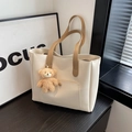 Off-white faux leather tote bag with caramel brown straps and cute teddy bear charm - Off-white With Pendant