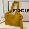 Ginger yellow puffy tote bag featuring quilted texture and large knot shoulder strap - Yellow