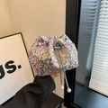 Iridescent sequin bucket bag with drawstring closure and pearl chain strap detail - Colorful