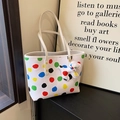 White faux leather tote bag with colorful polka dots and cute puppy pendant accessory - White