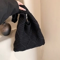 Minimalist black knit tote bag featuring thick woven diamond pattern and single shoulder strap - Black