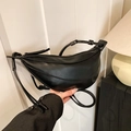 Minimalist black crescent crossbody bucket bag with smooth leather finish and zipper closure - Black