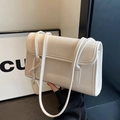 Minimalist cream white shoulder bag in glossy faux leather with a flap closure design - Off-white