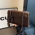Dark brown glossy leather shoulder bag with sleek rectangular shape and heart charm detail - Coffee