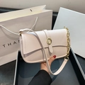 Chic off-white textured leather underarm bag with gold oval buckle and chain strap - Off White
